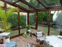 Wohnimmobilie Kauf Erdgeschosswohnung Liebevoll gepflegte 4-Zimmer-Wohnung auf zwei Etagen mit Wintergarten
