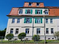 Wohnimmobilie Kauf Erdgeschosswohnung Drei-Zimmer-Wohnung mit Balkon und Gemeinschaftsgarten